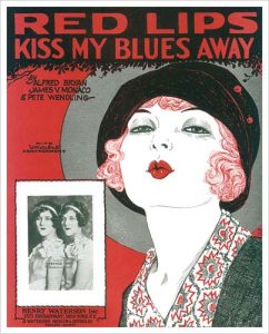 1900s poster that says red lips kiss my blues away