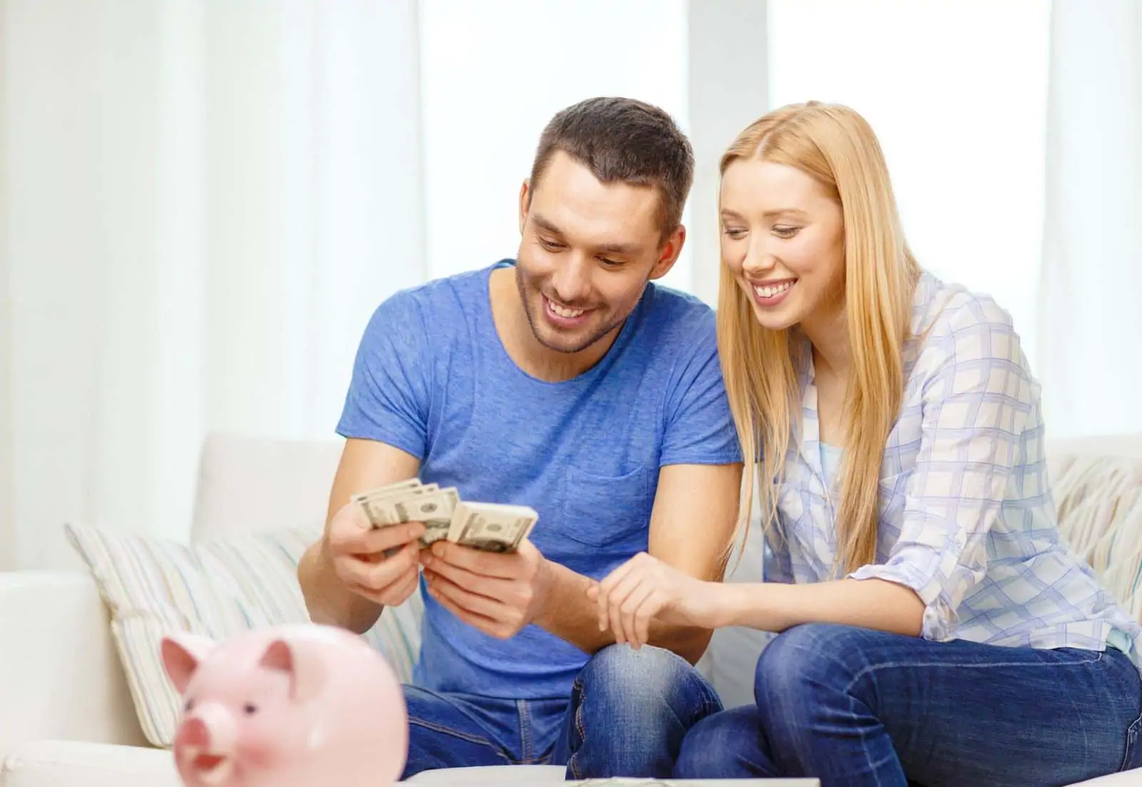 couple receiving a private mortgage for landlords and counting cash
